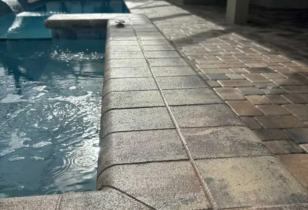 Paver Sealing. Paver Restoration. Sealed paver coping